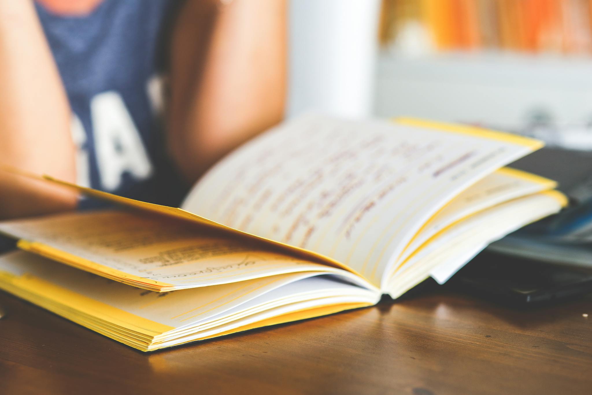 An open notebook with handwritten notes, perfect for study, education, or creative writing.